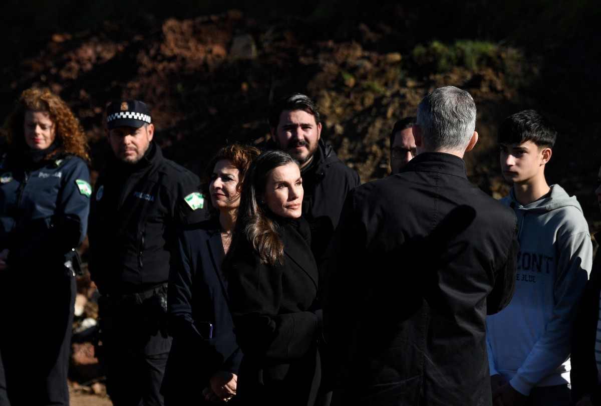 Spain's King Felipe VI (back) and Queen Letizia, followed by Spain's deputy prime minister Maria Jesus Montero, meet persons who helped on the site of a high-speed trains collision that kill ...