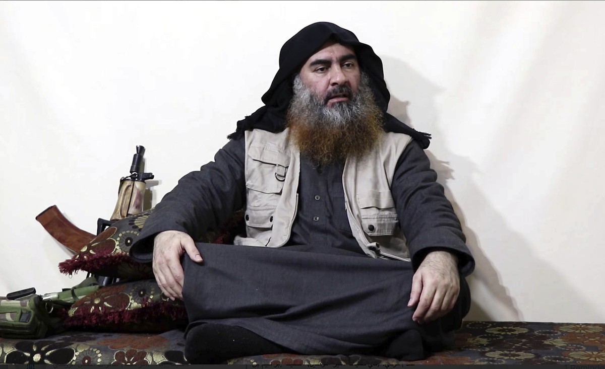 This image made from video posted on a militant website on Monday, April 29, 2019, purports to show the leader of the Islamic State group, Abu Bakr al-Baghdadi, being interviewed by his group's A ...