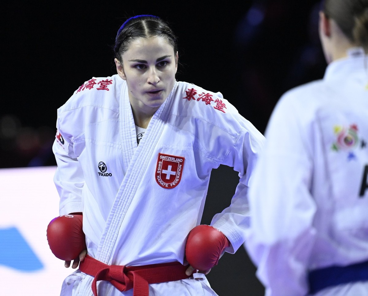 epa10945258 Elena Quirici (red) of Switzerland and Irina Zaretska of Azerbaijan fight in the final match of women's 68kg kumite competition of the 26th WKF World Karate Championships in Papp Lasz ...