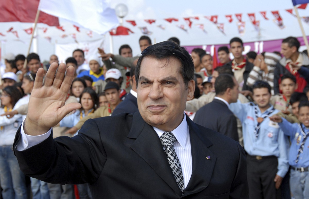 FILE - In this Nov.7, 2007 file photo, Tunisian President Zine EL Abidine Ben Ali waves to supporters in Rades, outside Tunis, before celebrations marking the 20th anniversary of Ben Ali's presid ...