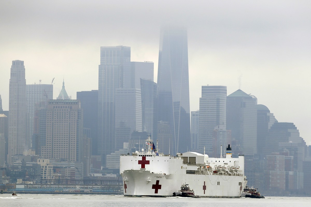 The Navy hospital ship USNS Comfort passes lower Manhattan on its way to docking in New York, Monday, March 30, 2020. The ship has 1,000 beds and 12 operating rooms that could be up and running within ...