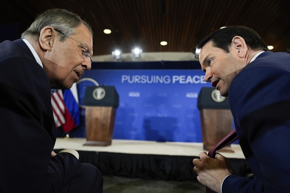 Secretary of State Marco Rubio shows his tie to Russia&#039;s Foreign Minister Sergey Lavrov before a news conference with President Donald Trump and Russia&#039;s President Vladimir Putin at Joint Ba ...