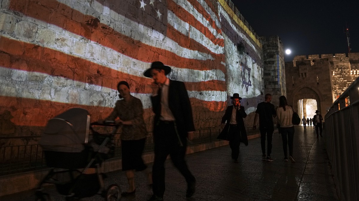 An Image of the U.S. and Israeli flags is projected on the walls of Jerusalem's Old City in honor of President Joe Biden visit to Jerusalem, Wednesday, July 13, 2022. Biden arrives in Israel on W ...