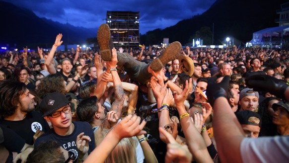 Festival goers enjoy the concert of Australian metalcore band Parkway Drive on the main stage (Jungfrau stage), during the Greenfield Openair Festival, this Thursday, June 7, 2018 in Interlaken, Switz ...