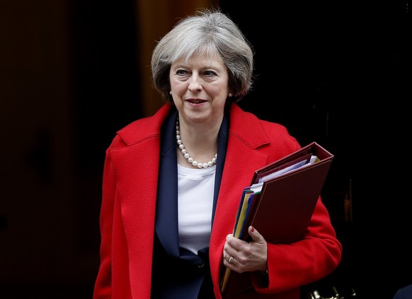 FILE - In this Wednesday, Nov. 23, 2016 file photo, Britain&#039;s Prime Minister Theresa May leaves 10 Downing Street to attend the weekly Prime Ministers&#039; Questions session, in parliament in Lo ...