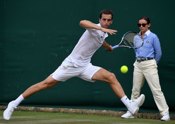 epa06070895 Albert Ramos-Vinolas of Spain in action against Andrey Rublev of Russia during their second round match for the Wimbledon Championships at the All England Lawn Tennis Club, in London, Brit ...