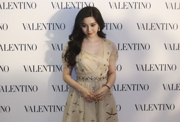 Chinese actress Fan Bingbing poses during a promotional event for the opening of a new store of fashion brand Valentino in Hong Kong Thursday, Feb. 5, 2015. (AP Photo/Kin Cheung)