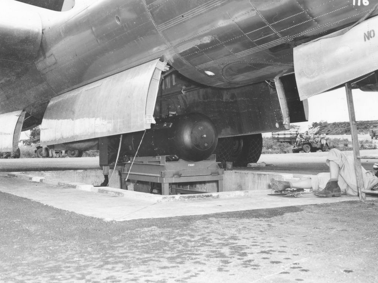 View of the atomic bomb, codenamed &#039;Little Boy,&#039; as it is hoisted into the bomb bay of the B-29 Superfortress &#039;Enola Gay&#039; on the North Field of Tinian airbase, North Marianas Islan ...