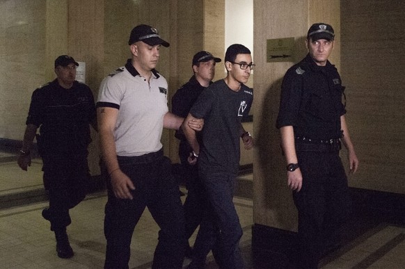 epa05470295 French national Mourad Hamyd (2-R) is escorted by Bulgarian Police officers in the court halls before his trail in Sofia, Bulgaria, 10 August, 2016. Hamyd is the brother-in-law of one of t ...