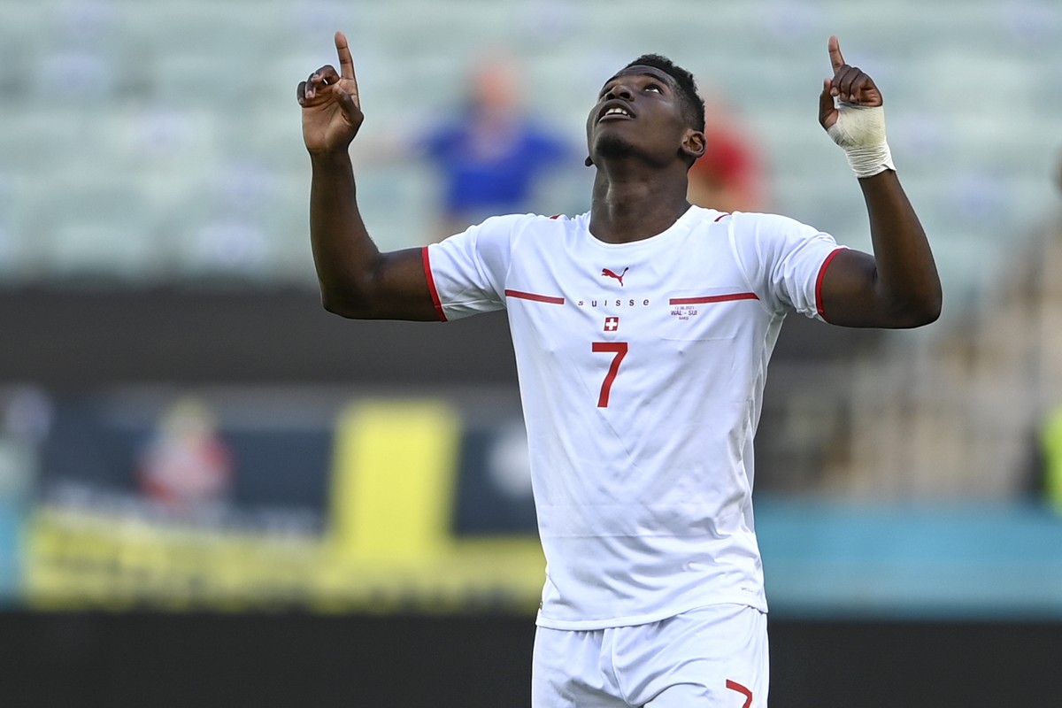 Switzerland's Breel Embolo celebrates after scoring his side's opening goal during the Euro 2020 soccer championship group A match between Wales and Switzerland, at the Baku Olympic stadium, ...