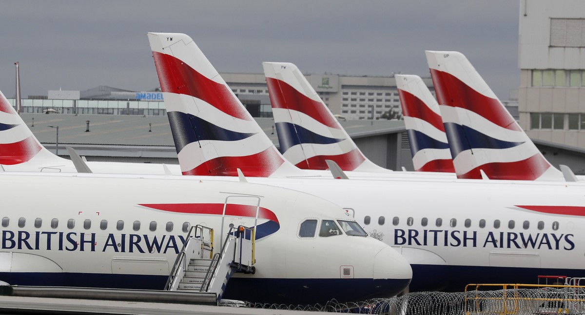 FILE - British Airways planes parked at Heathrow Airport's Terminal 5 in London, Wednesday, March 18, 2020. Mixed signals are emerging about travel in Europe heading into the winter season. Briti ...