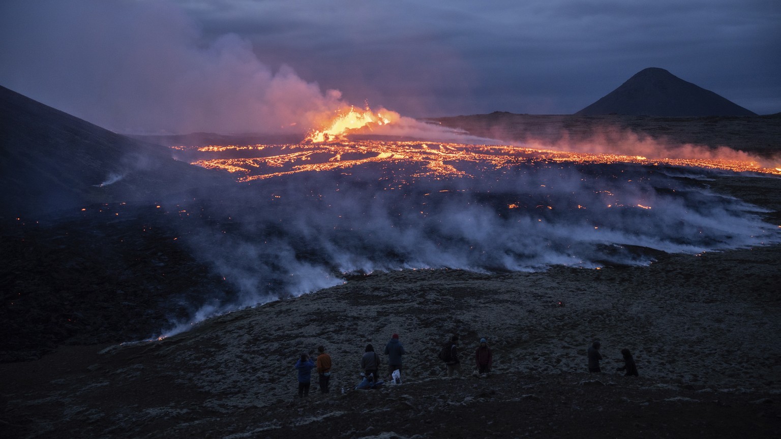 Lava emerges from a fissure of the Fagradalsfjall volcano near the Litli-Hr