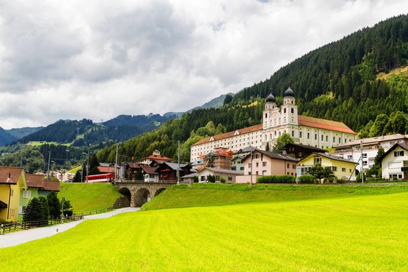 DISENTIS -MUSTER, SWITZERLAND - AUGUST 10: Benedictine monastery in the Swiss Alps, Disentis -Muster, Switzerland on August 10, 2014. The monastery was built between 1696 and 1712.