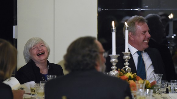 Federal Reserve Chair Janet Yellen and British Ambassador Kim Darroch laugh during a speech at the National Economists Club event at the British Embassy in Washington, Friday, Oct. 20, 2017. (AP Photo ...