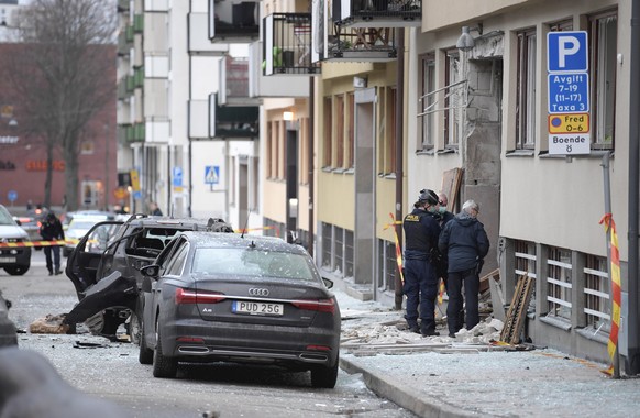 epa08124739 Police examine the site where an explosion damaged a residential building and cars in central Stockholm, Sweden, 20 January 2020. The building and nearby buildings as well as several cars  ...