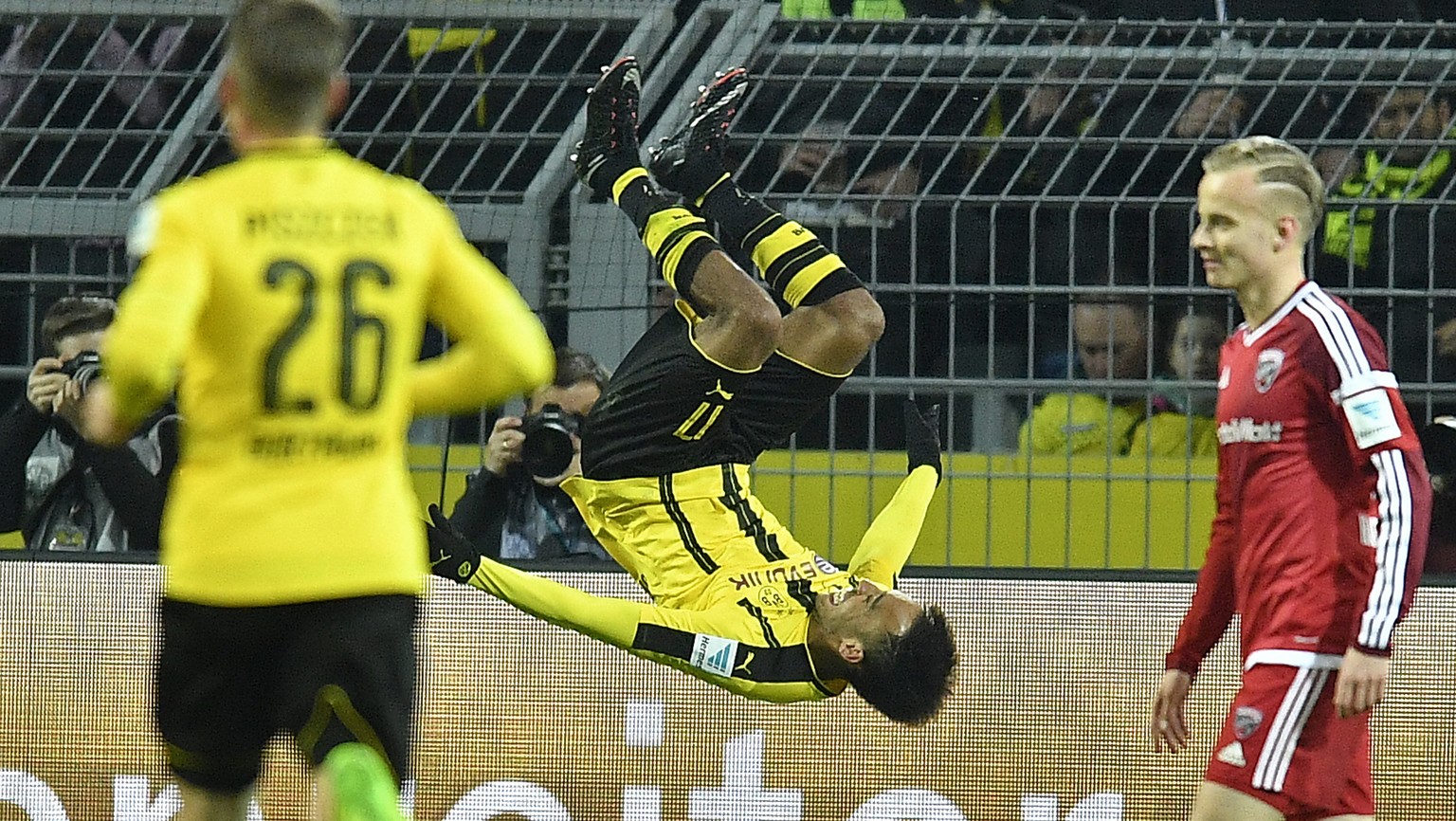 Dortmund&#039;s Pierre-Emerick Aubameyang jumps a salto after scoring the opening goal during the German Bundesliga soccer match between Borussia Dortmund and FC Ingolstadt in Dortmund, Friday, March  ...