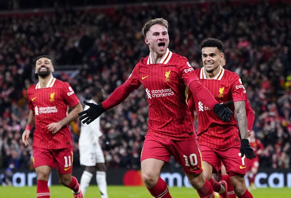 Liverpool&#039;s Alexis Mac Allister celebrates with Luis Diaz after scoring his sides first goal during the Champions League opening phase soccer match between Liverpool and Real Madrid at Anfield St ...