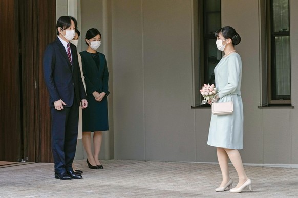 Japan&#039;s Princess Mako, right, talks with her parents Crown Prince Akishino, Crown Princess Kiko and her sister Princess Kako, third from left, before leaving her home in Akasaka Estate in Tokyo T ...