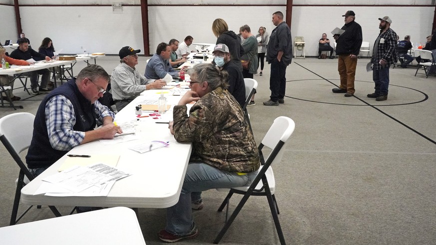 People gather at the Norfolk Southern Railways Assistance Center at the Abundant Life Fellowship in East Palestine, Ohio, on Thursday, February 9, 2013.  Clearance of a freight train in Norfolk Southern continues…