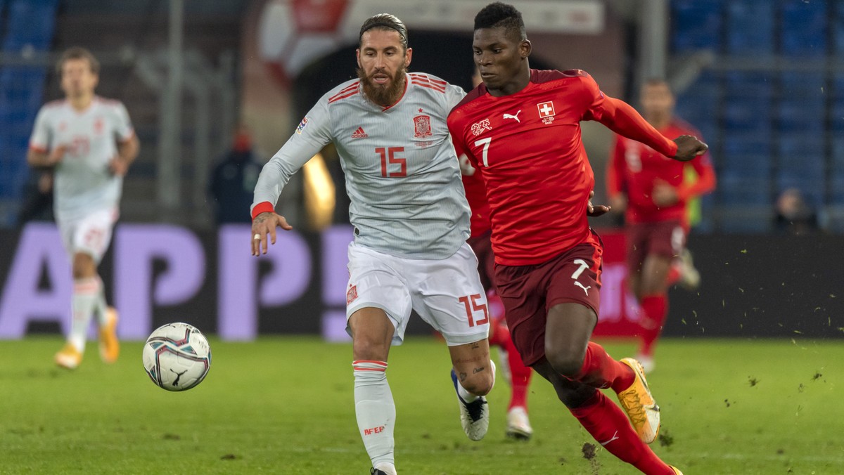 Spain's Sergio Ramos, left, fights for the ball against Switzerland's Breel Embolo, right, during the UEFA Nations League group 4 soccer match between Switzerland and Spain at the St. Jakob- ...