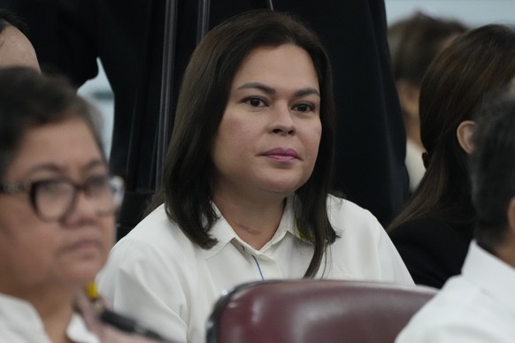 Philippine Vice President Sara Duterte listens as she attends a joint committee hearing of the House of Representatives in Quezon City, Philippines on Wednesday, Nov. 13, 2024, investigating the war o ...