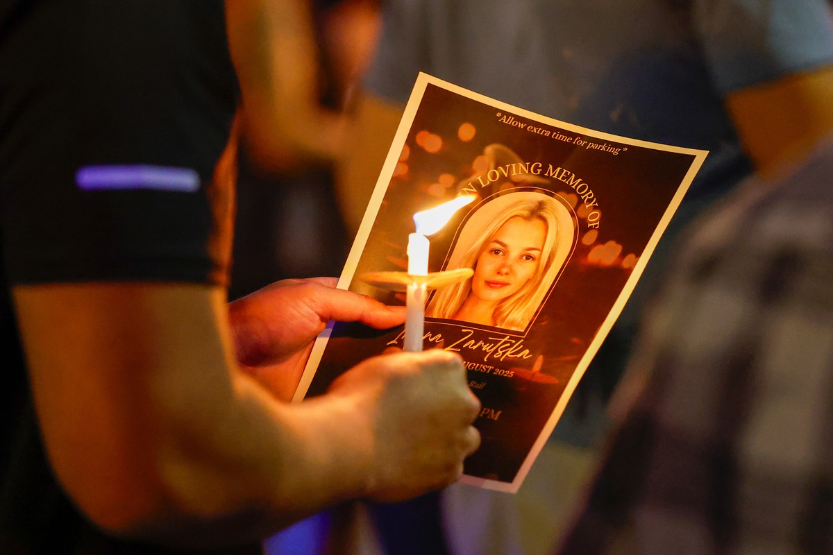 FILE - Community members gather for a vigil honoring the life of Iryna Zarutska, a Ukranian refugee, who was fatally stabbed on a commuter train, Sept. 22, 2025, in Charlotte, N.C. (AP Photo/Nell Redm ...