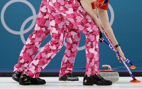 Norway men&#039;s curling team wear pants with heart-shape prints during their men&#039;s curling match against Japan at the 2018 Winter Olympics in Gangneung, South Korea, Wednesday, Feb. 14, 2018. ( ...