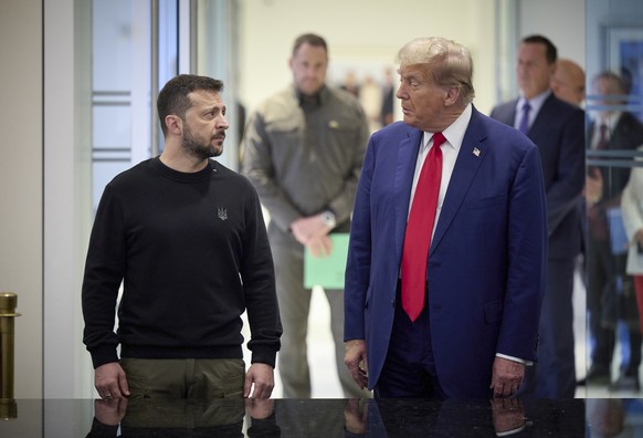 epa11629049 A handout picture made available by the Ukraine Presidential Press Service shows Ukrainian President Volodymyr Zelensky (L) and Republican presidential candidate Donald J. Trump (R), durin ...