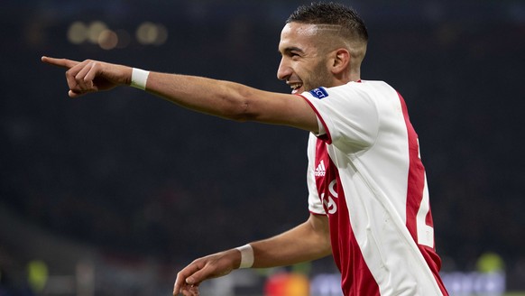 epa07367984 Hakim Ziyech of Ajax Amsterdam jubilates after his 1-1 goal during the UEFA Champions League round of 16 first leg soccer match between Ajax Amsterdam and Real Madrid in AMsterdam, Netherl ...