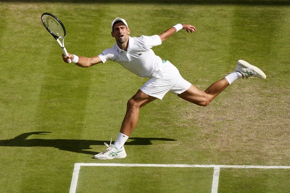 FILE - Serbia&#039;s Novak Djokovic returns to Australia&#039;s Nick Kyrgios in the final of the men&#039;s singles on day fourteen of the Wimbledon tennis championships in London, Sunday, July 10, 20 ...