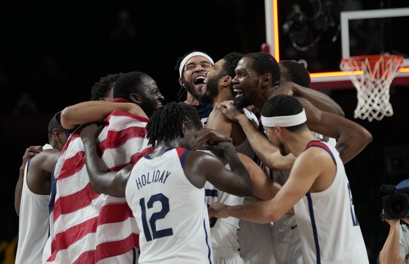 United States&#039; players celebrate after their win in the men&#039;s basketball gold medal game against France at the 2020 Summer Olympics, Saturday, Aug. 7, 2021, in Saitama, Japan. (AP Photo/Eric ...