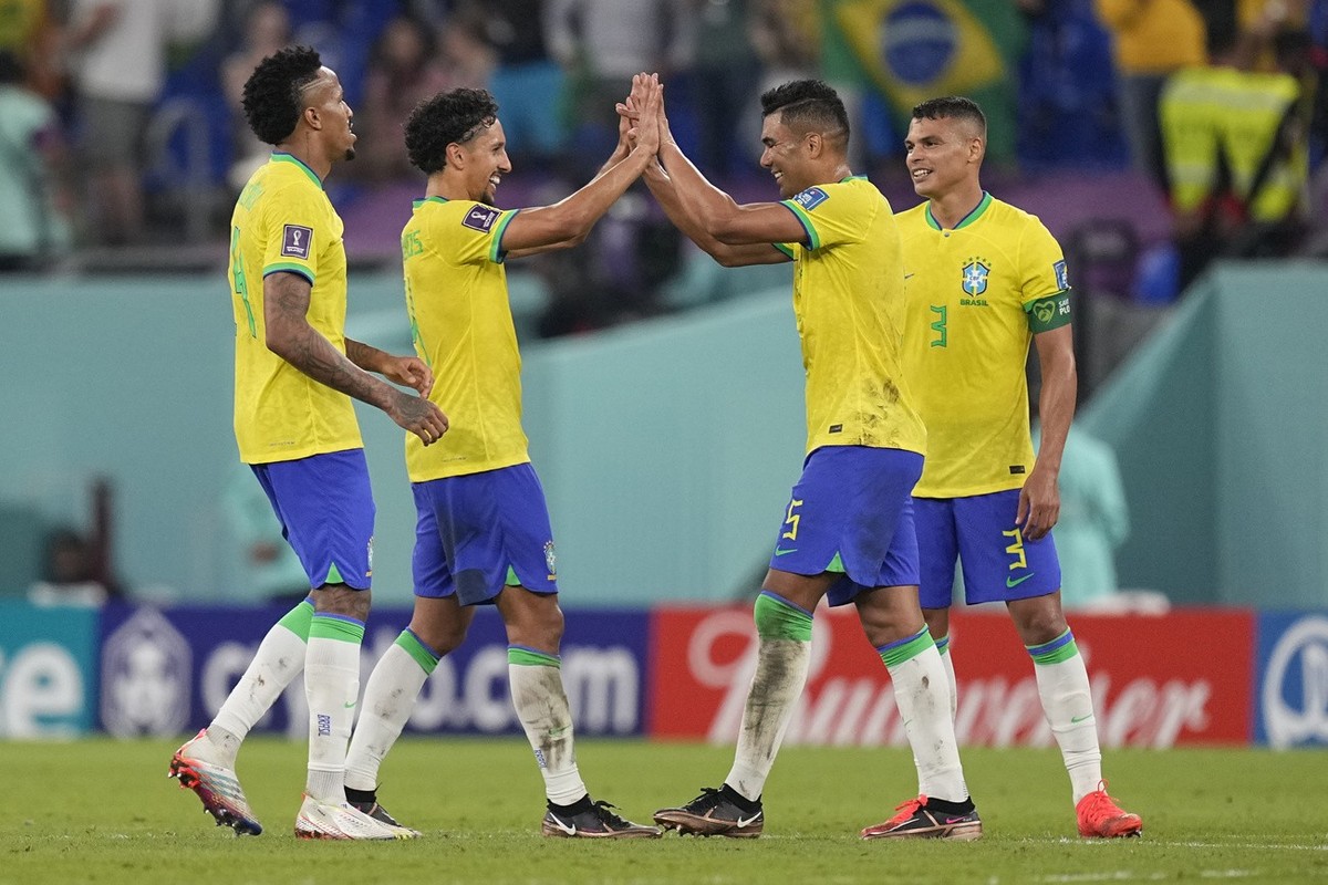 Brazil's Casemiro, second right, celebrates with teammates at the end of the World Cup group G soccer match between Brazil and Switzerland, at the Stadium 974 in Doha, Qatar, Monday, Nov. 28, 202 ...
