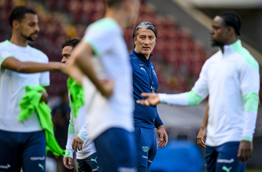 Switzerland&#039;s head coach Murat Yakin talks to his players during a training session on the eve of the UEFA Nations League group A2 soccer match between Switzerland and Portugal at the Stade de Ge ...