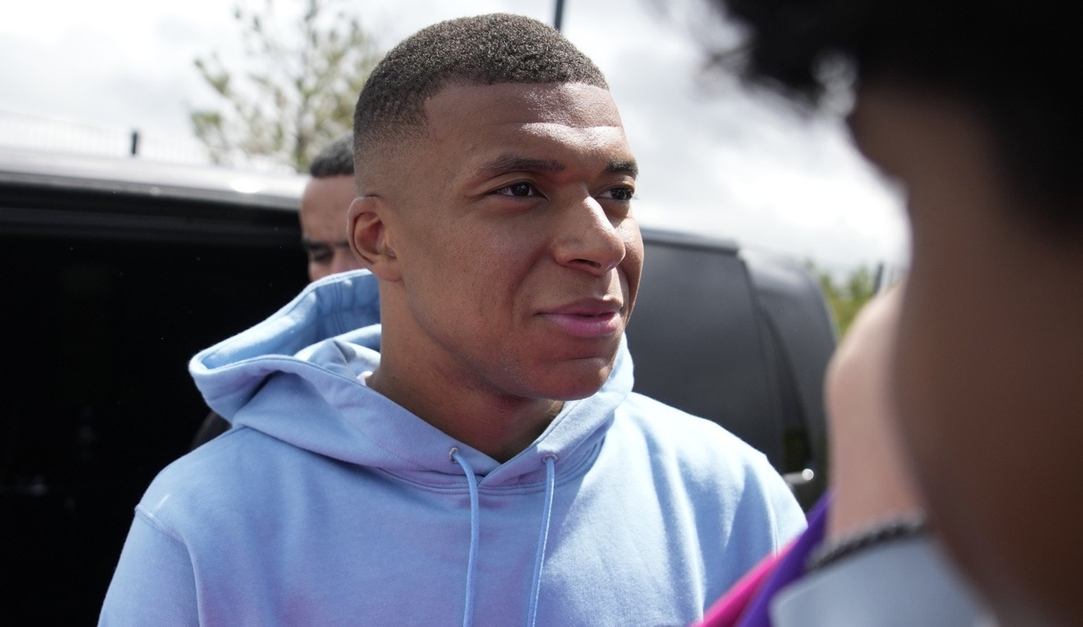 PSG&#039;s Kylian Mbappe meets fans as he leaves the Paris Saint-Germain training complex, Friday, July 28, 2023 in Poissy, outside Paris. Speculation is mounting as to where Mbapp