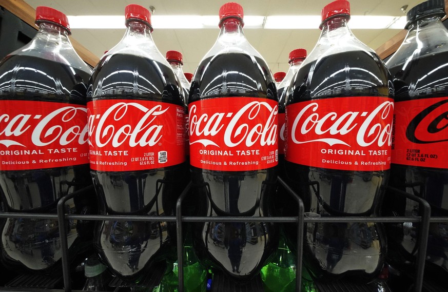 Bottles of Coca-Cola are on display at a grocery market in Uniontown, Pa, on Sunday, April 24, 2022. (AP Photo/Gene J. Puskar)