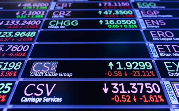 epa10524323 A screen shows information about the bank Credit Suisse on the floor of the New York Stock Exchange in New York, New York, USA, on 15 March 2023. The Dow Jones industrial average was down  ...