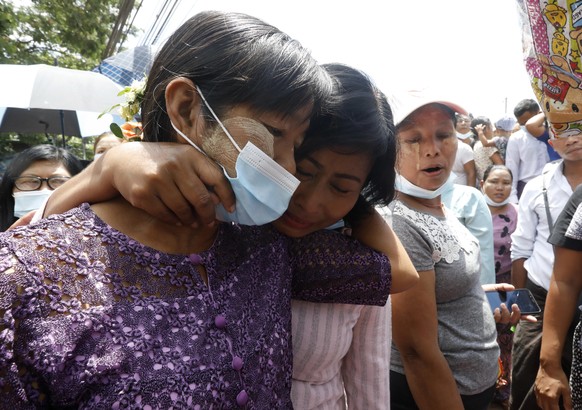 epa09140769 A released prisoner (L) greets with her friend after being granted amnesty, outside the Insein Prison in Yangon, Myanmar, 17 April 2021. Military Junta granted amnesty to over 20,000 peopl ...