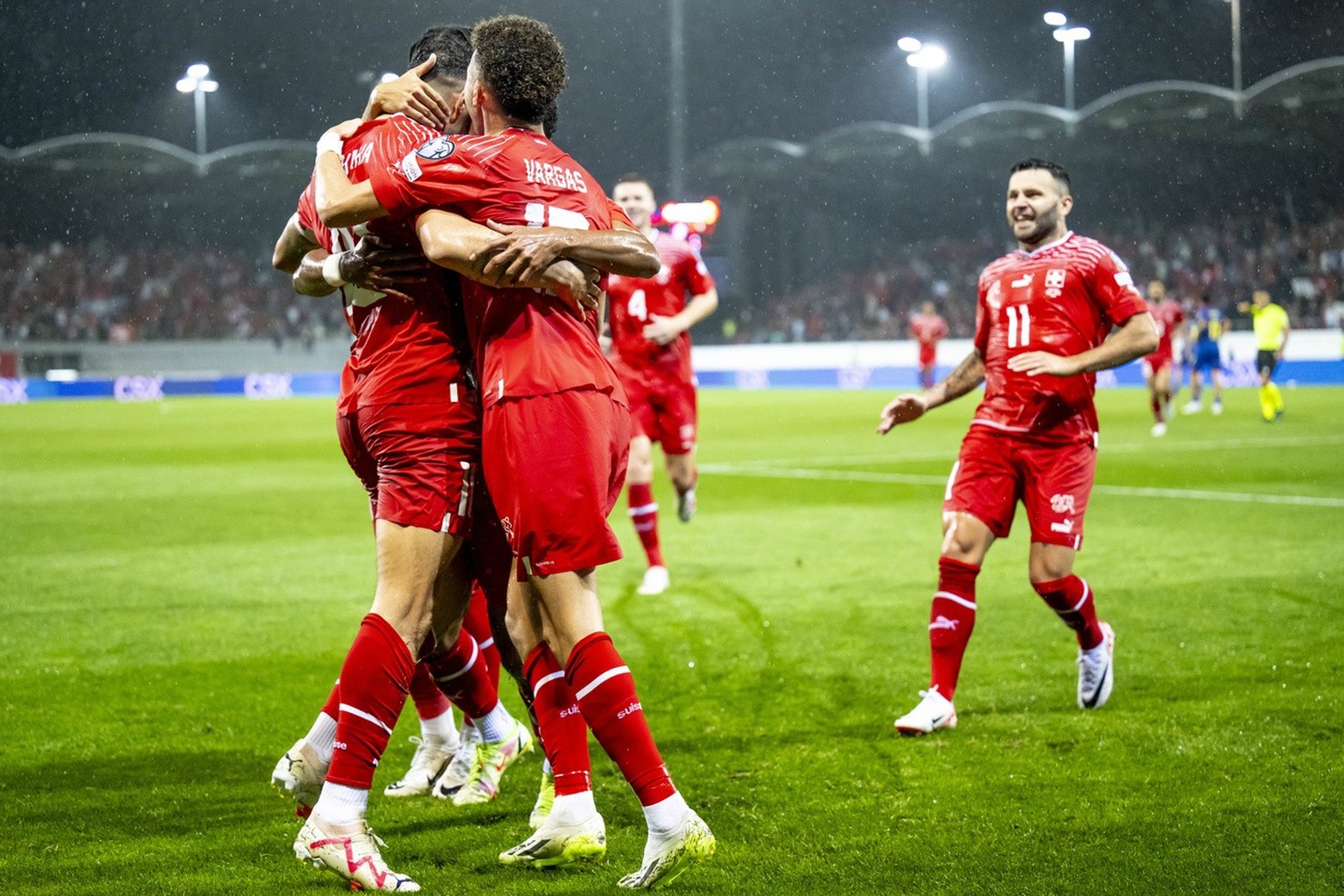 Switzerland&#039;s midfielder Granit Xhaka, left, celebrates the 2-0 goal with teammates Ruben Vargas, second from left, and Renato Steffen, right, during the UEFA Euro 2024 qualifying group I soccer  ...