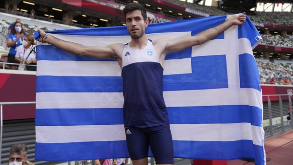 Miltiadis Tentoglou, of Greece, celebrates after winning men&#039;s long jump final at the 2020 Summer Olympics, Monday, Aug. 2, 2021, in Tokyo. (AP Photo/Matthias Schrader)