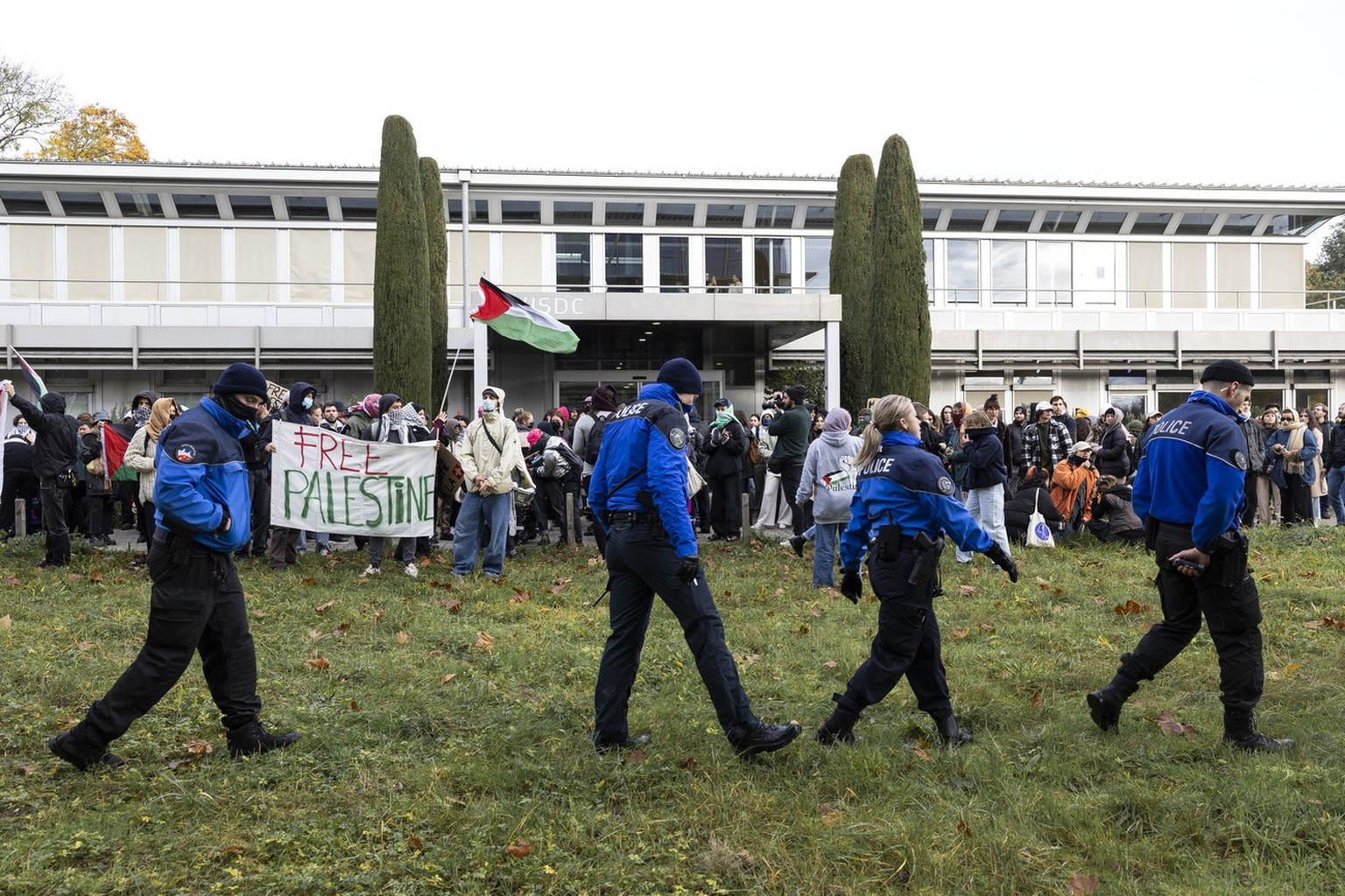 People hold up placards during a demonstration against the visit of Emmanuel Macron and Alain Berset to the University of Lausanne (UNIL) . This week, French President Emmanuel Macron is making an off ...