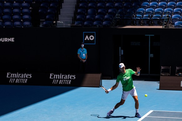 epa09681756 Novak Djokovic of Serbia in action during a training session at Melbourne Park in Melbourne, Australia, 13 January 2022. Defending Australian Open champion Djokovic remains in limbo awaiti ...