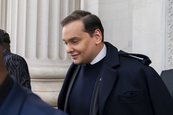 FILE - Rep. George Santos, R-N.Y., leaves the Capitol after being expelled from the House of Representatives, Friday, Dec. 1, 2023, in Washington. The disgraced former U.S. representative is due back  ...