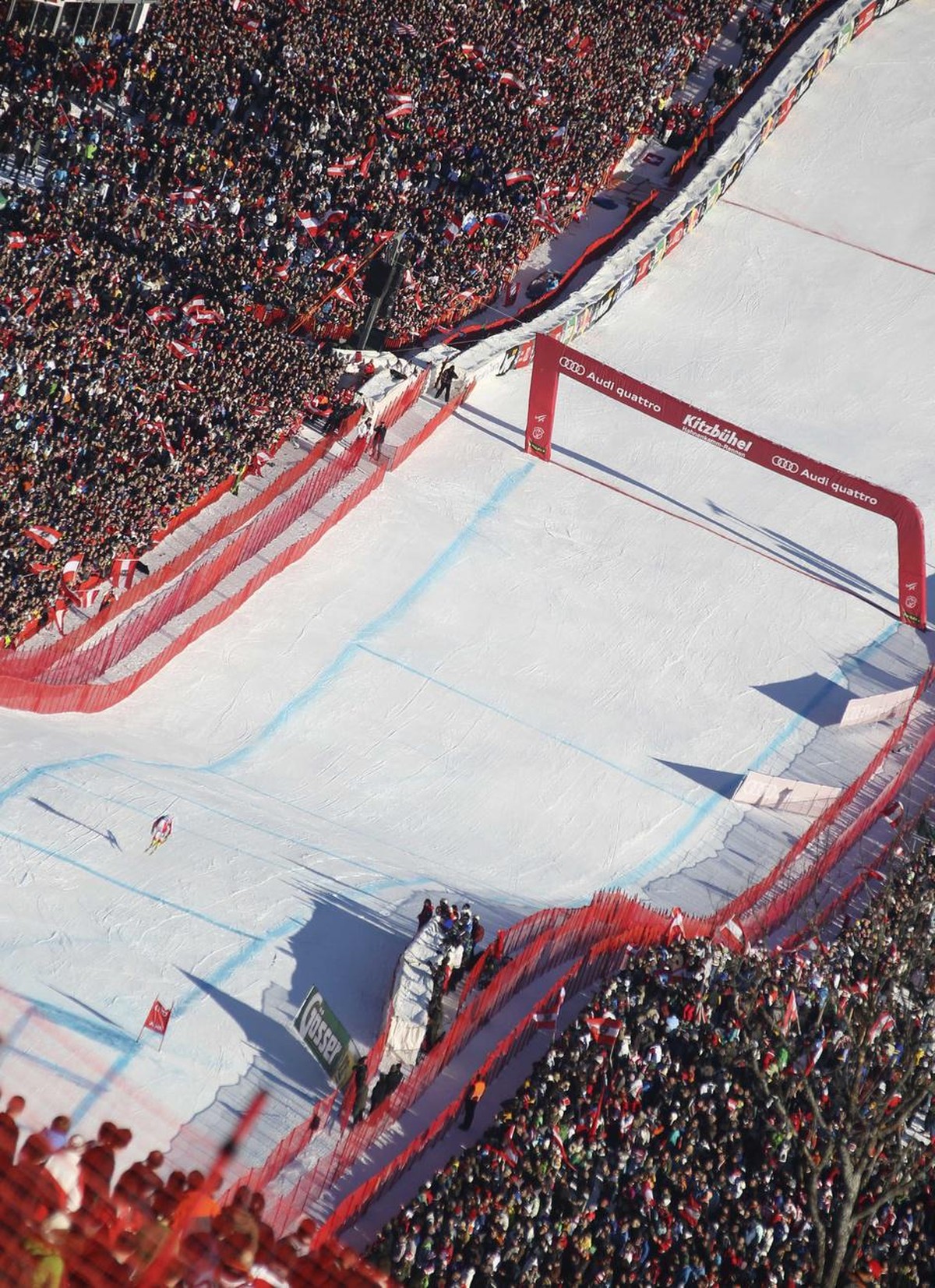 Switzerland's Didier Cuche speeds down the course on his way to win an alpine ski, Men's World Cup Downhill race, in Kitzbuehel, Austria, Saturday, Jan. 23, 2010. (AP Photo/Alessandro Trovat ...