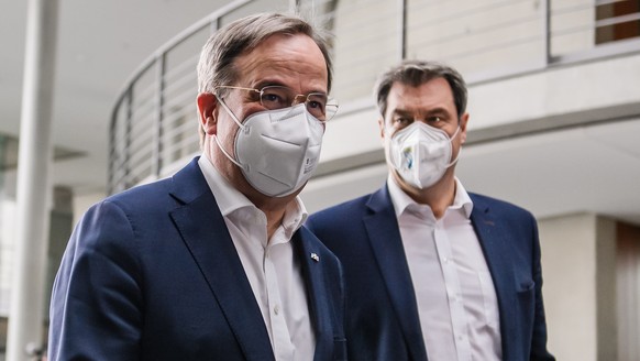 epa09128965 Christian Democratic Union (CDU) party chairman Armin Laschet (L) and State Premier of Bavaria and Christian Social Union (CSU) chairman Markus Soeder arrive for a joint press conference o ...