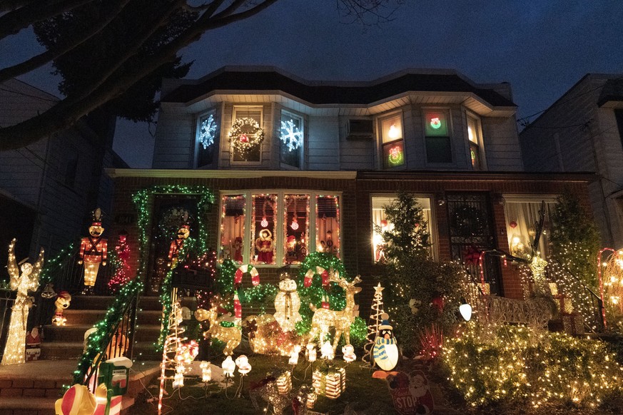 Holiday lights and decorations adorn houses in Brooklyn&#039;s Dyker Heights neighborhood, Tuesday, Dec. 22, 2020 in New York. Residents are renowned for their displays of over-the-top Christmas light ...