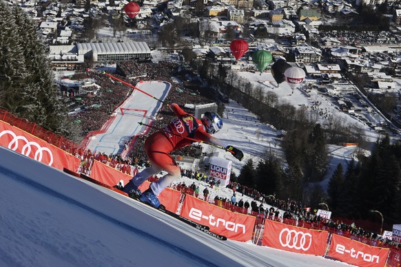 Switzerland&#039;s Marco Odermatt speeds down the course during an alpine ski, men&#039;s World Cup downhill race, in Kitzbuehel, Austria, Saturday, Jan. 20, 2024. (AP Photo/Marco Trovati)