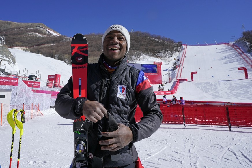 Haiti&#039;s Richardson Viano smiles as he speaks just outside the finish area of the alpine skiing course at the 2022 Winter Olympics, Wednesday, Feb. 2, 2022, in the Yanqing district of Beijing. (AP ...