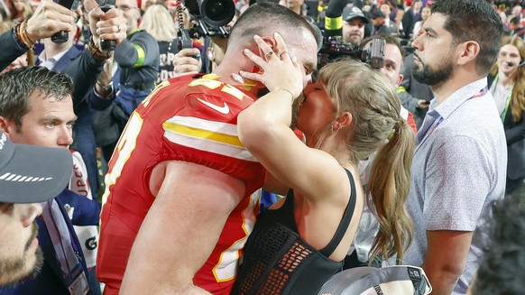 epa13082569 (FILE) - Kansas City Chiefs tight end Travis Kelce (L) kisses US singer Taylor Swift following the Chiefs' victory in overtime of Super Bowl LVIII between the Kansas City Chiefs and t ...
