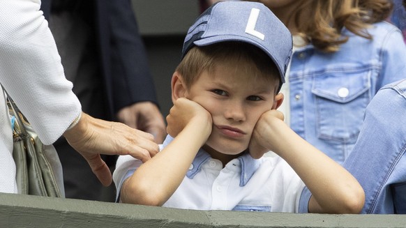 epa07690127 Roger Federer&#039;s children sit in the box during Federer&#039;s first round match against Lloyd Harris of South Africa, at the All England Lawn Tennis Championships in Wimbledon, London ...