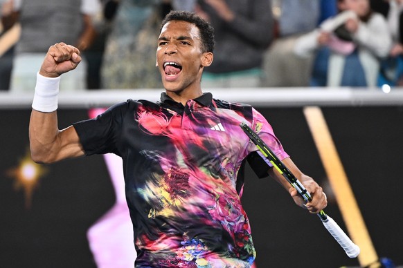 epa10412473 Felix Auger-Aliassime of Canada celebrates winning against Alex Molcan of Slovakia during the 2023 Australian Open tennis tournament at Melbourne Park in Melbourne, Australia, 18 January 2 ...